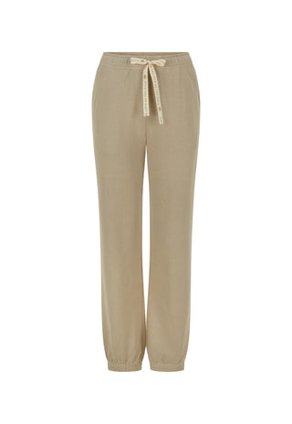 a-pair-of-beige-wide-leg-jogger-pants-with-an-elastic-waistband-and-a-matching-beige-drawstring-tie-shown-against-a-plain-white-background